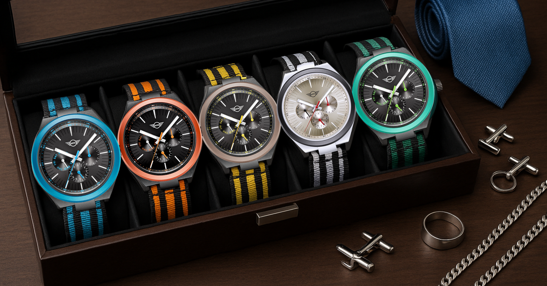 Collection of MINI Cooper Ocean Upcycle best minimalist watches in various colors displayed in a wooden box