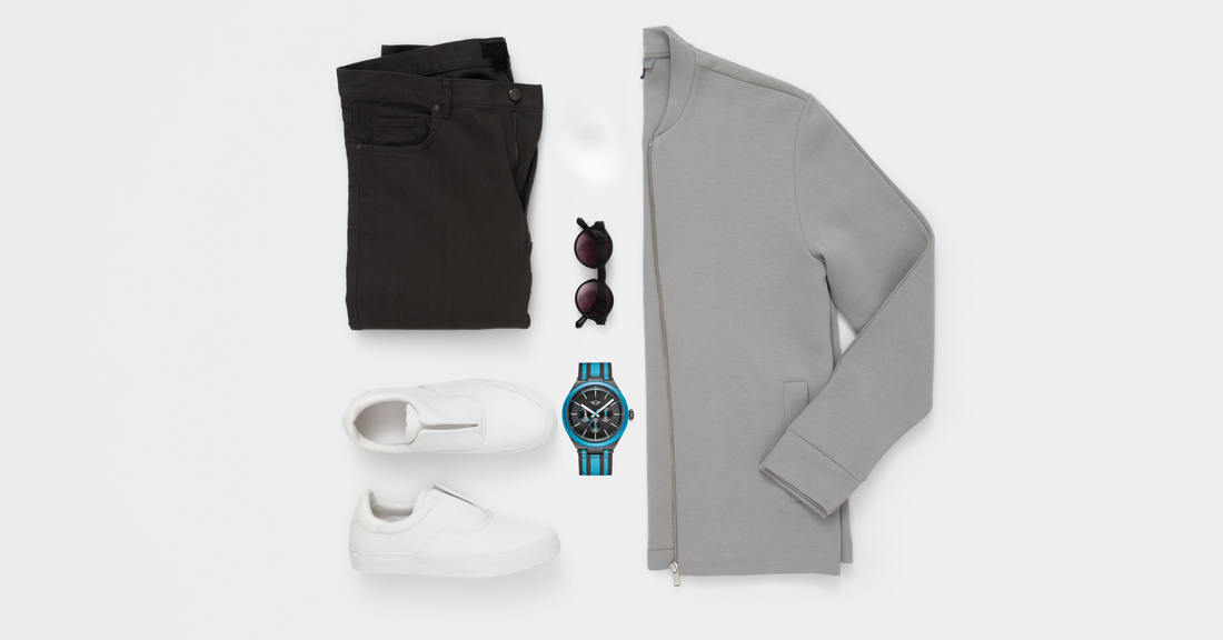 Casual outfit with gray cardigan, black pants, white sneakers, sunglasses, and blue watch in MINI Style Guide
