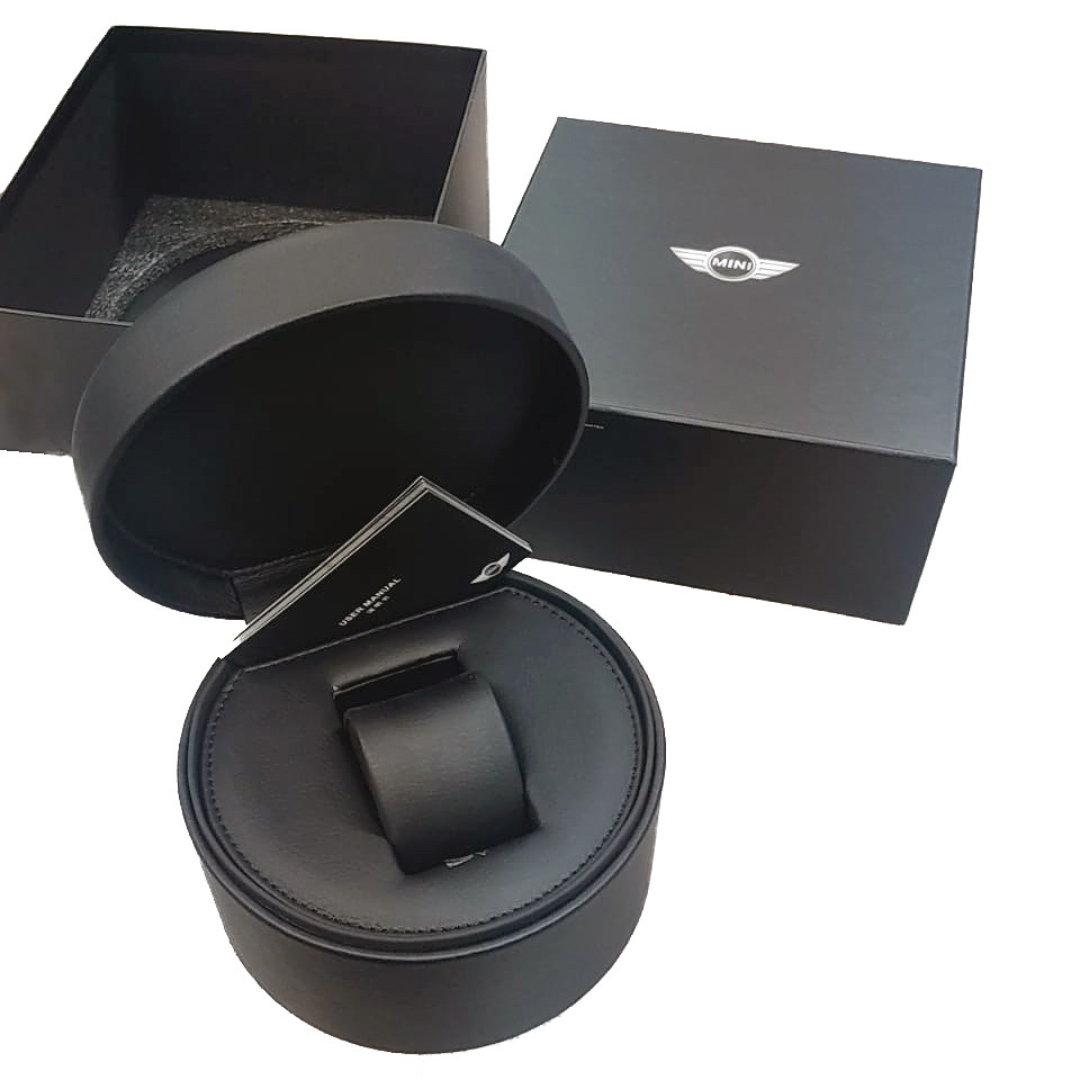 MINI Cooper Skeleton Wheel Dial Steel Bracelet Black watch displayed in black round presentation case with outer box
